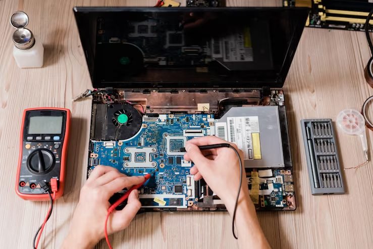 Board-level soldering repair on a laptop at FIXIT Mobile Care, Kuala Lumpur