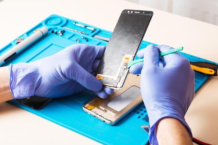 Phone opened on an anti-static mat at FIXIT Mobile Care, Kuala Lumpur