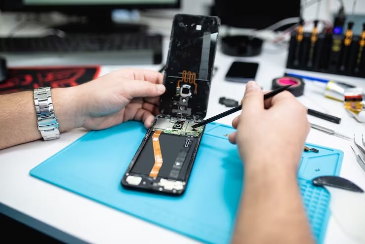 Close-up of phone repair work at FIXIT Mobile Care, Solaris Dutamas